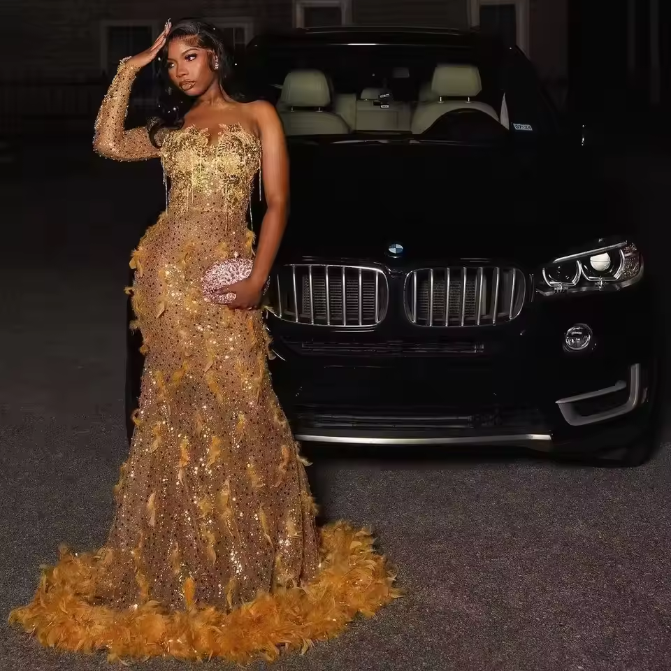 Shiny Gold Prom Dresses Custom Sexy Sheer Neck Beads Feather Evening Gowns Mermaid Sleeveless Beading Arabic Formal Party Gowns